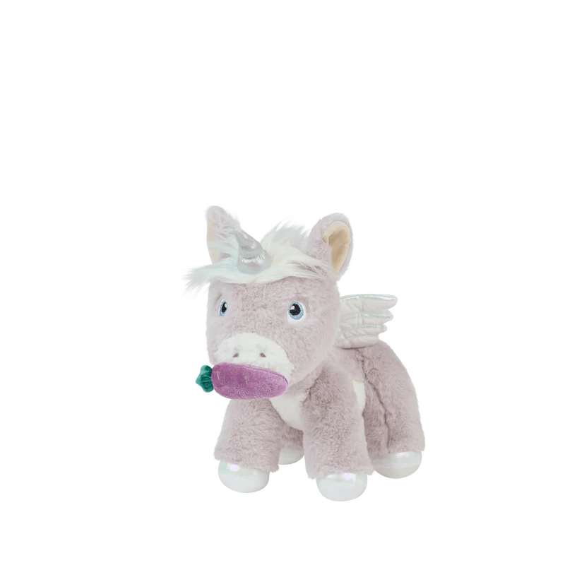 Child holding a stuffed animal unicorn against a light background