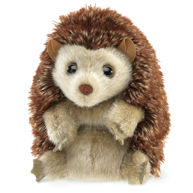Plush toy hedgehog with brown and beige fur on a white background