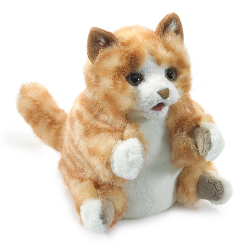 Plush toy cat with orange and white fur on a white background