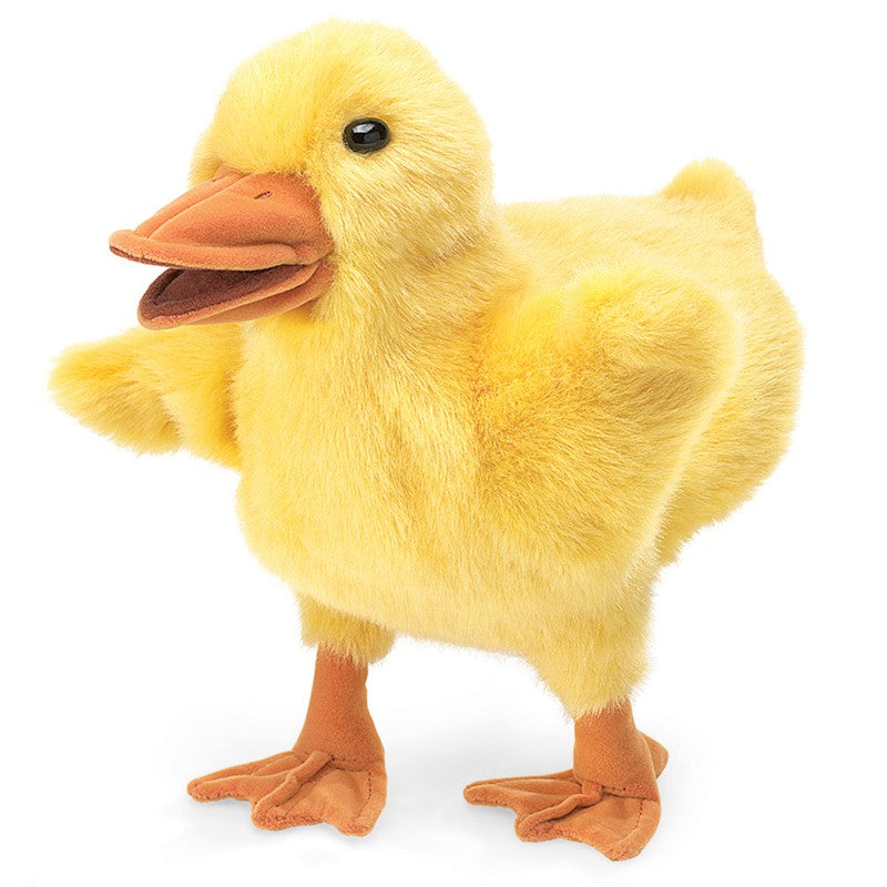 Yellow plush duck toy on a white background