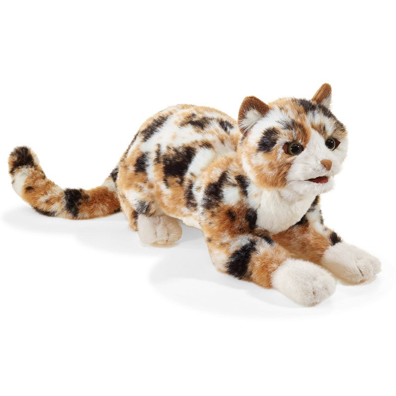Plush toy cat with tortoiseshell pattern on a white background
