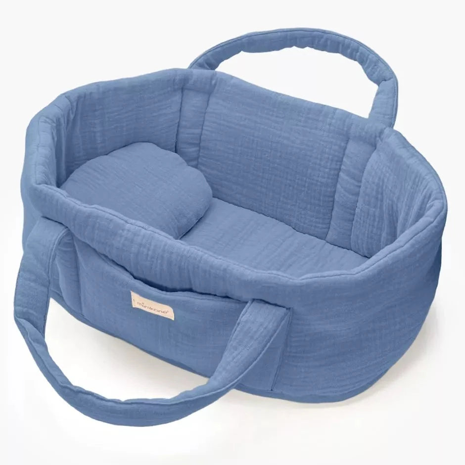 Blue baby doll basket with handles on a white background
