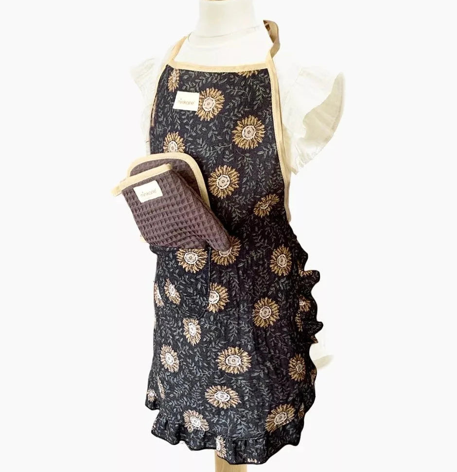 Floral-patterned apron on a mannequin with a white background