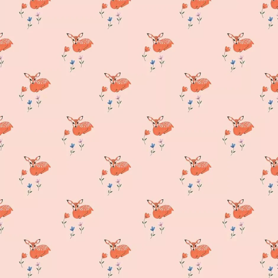 A repeating pattern of orange deer with small blue and orange flowers on a soft peach-pink background.