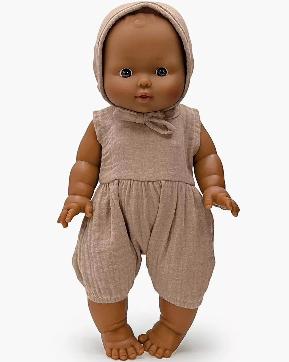Doll wearing a brown outfit with a matching bonnet on a white background