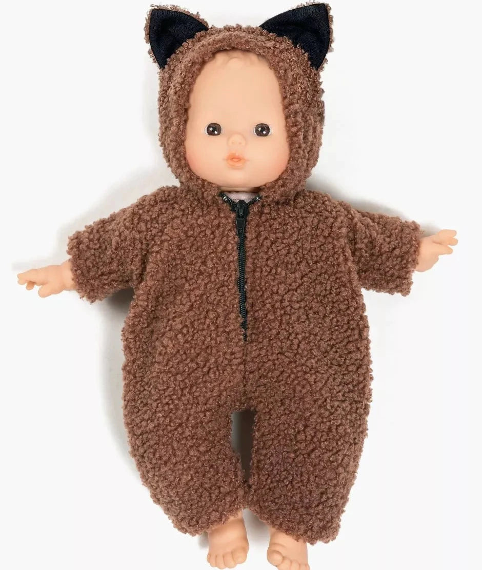 Doll wearing a brown fuzzy onesie with black ears on a white background