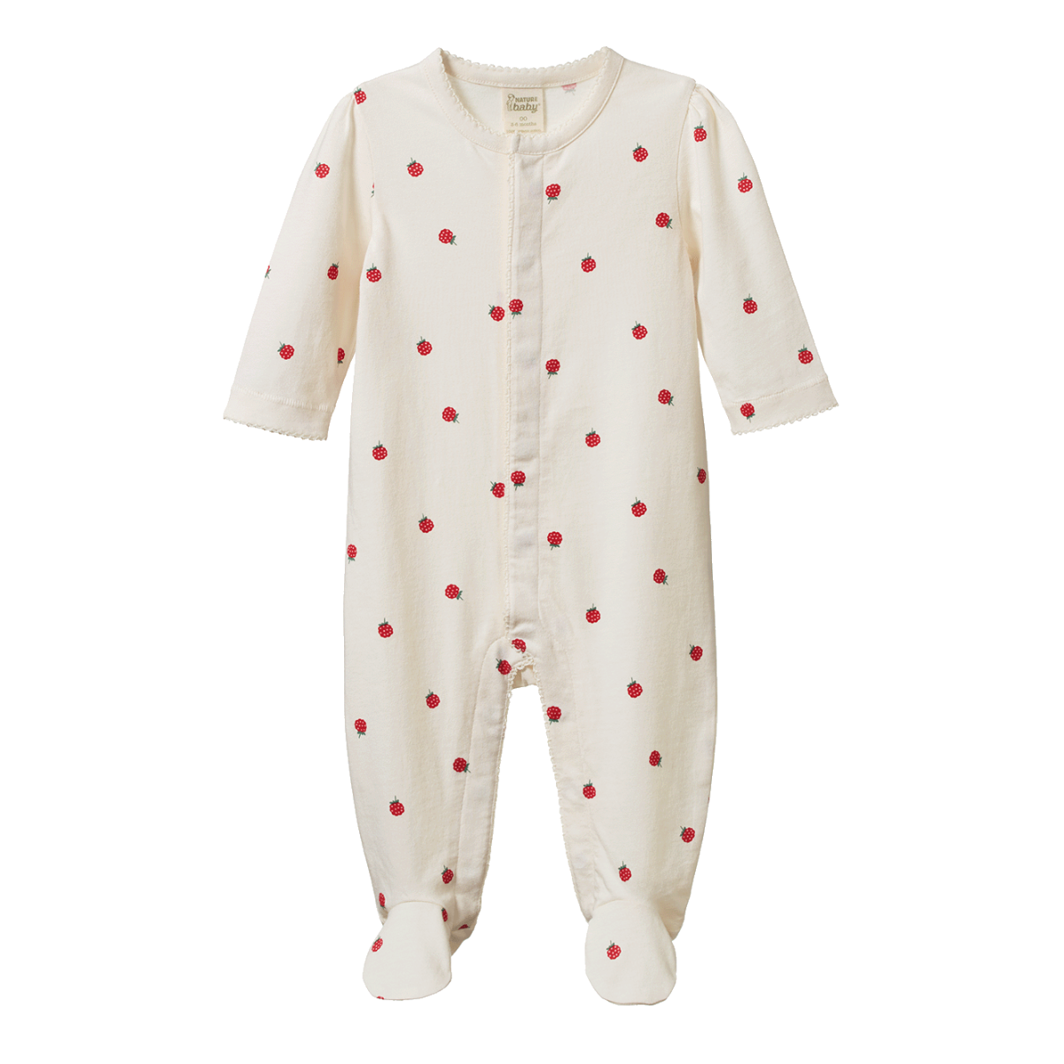 Baby wearing a cream-colored outfit with red berries on a brown fabric background
