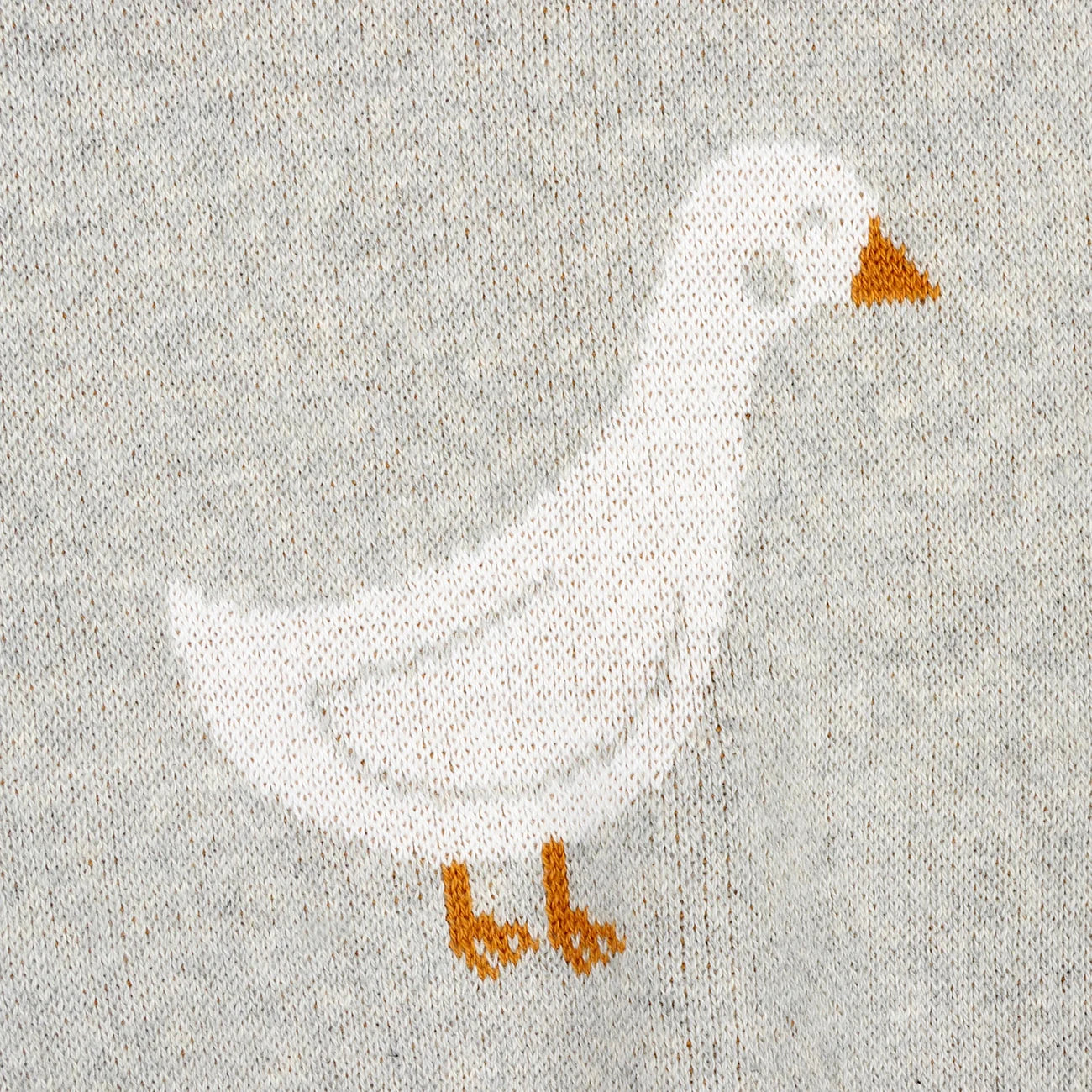 Knitted blanket with duck patterns on a white background