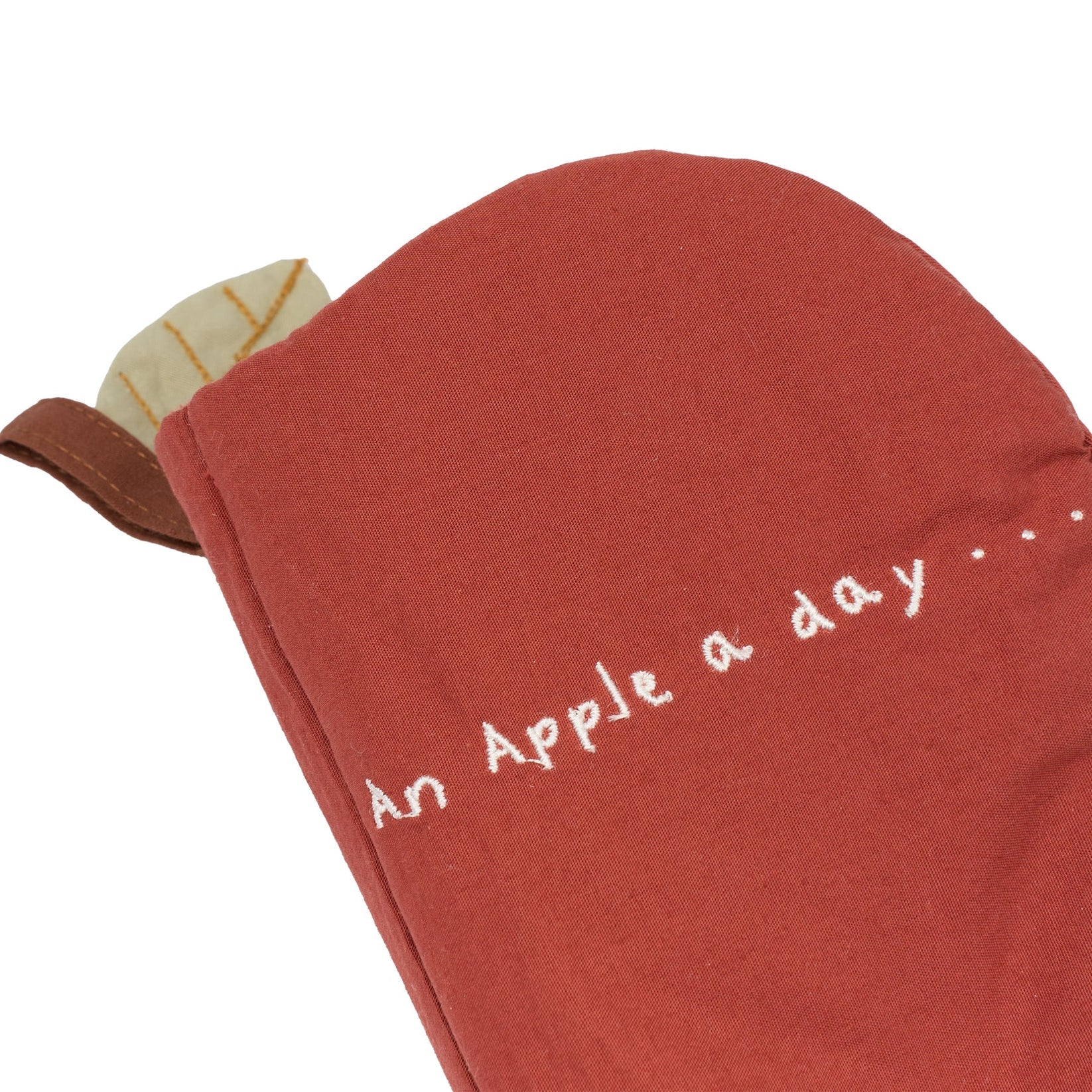 Red fabric book with 'An Apple a day' text on a white background