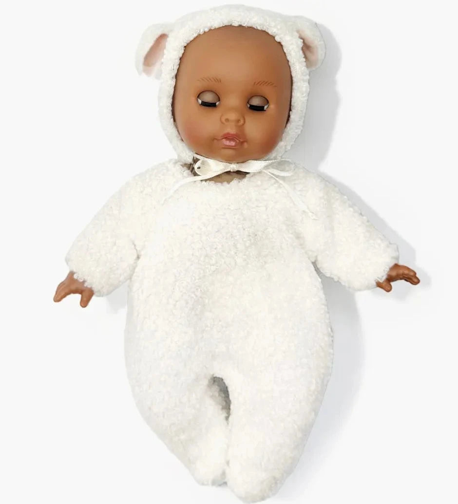Doll wearing a white fluffy outfit with bear ears on a white background
