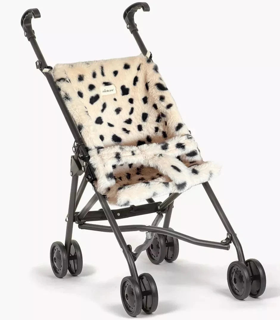 Doll stroller with a leopard print cover on a white background