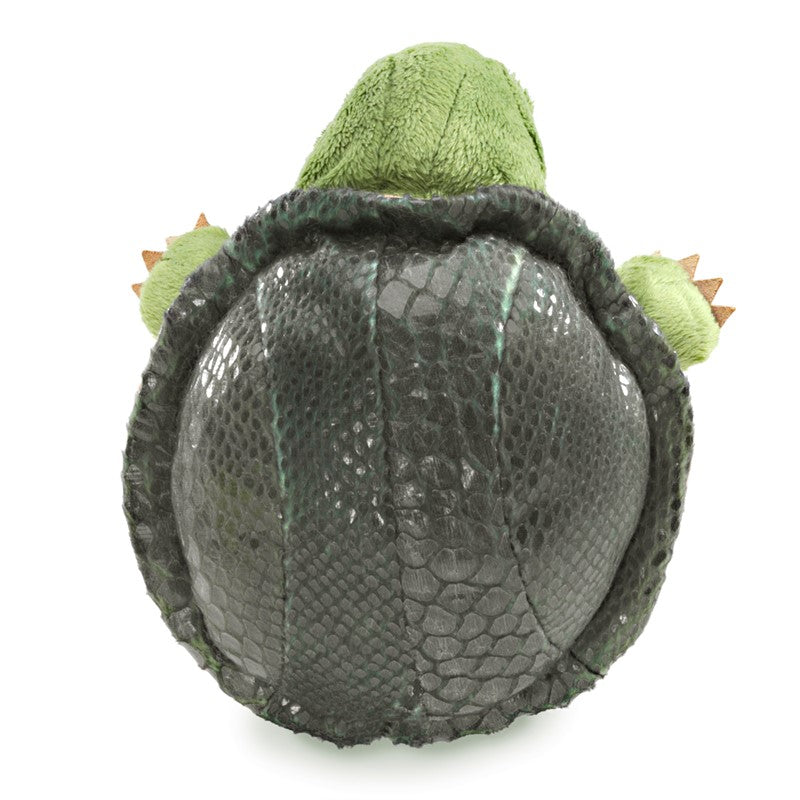 Plush toy turtle with a green body and gray shell on a white background