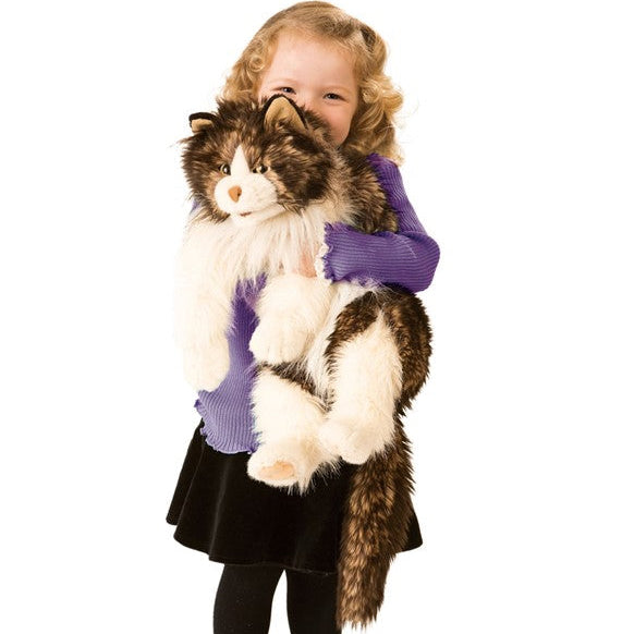 Plush toy cat with brown and white fur on a white background
