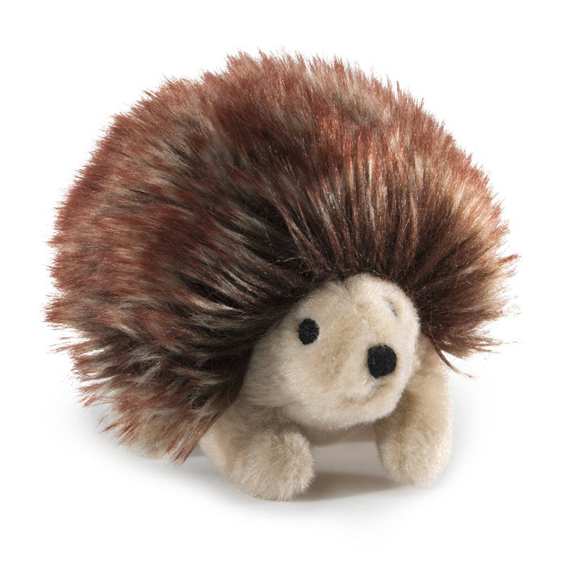 Hedgehog finger puppet on white background