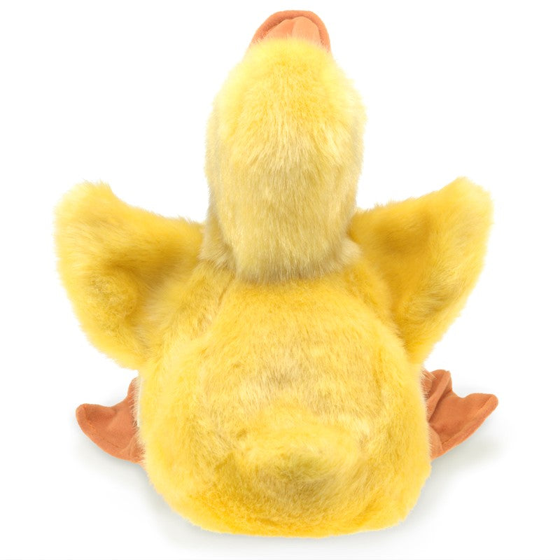 Yellow plush duck toy on a white background