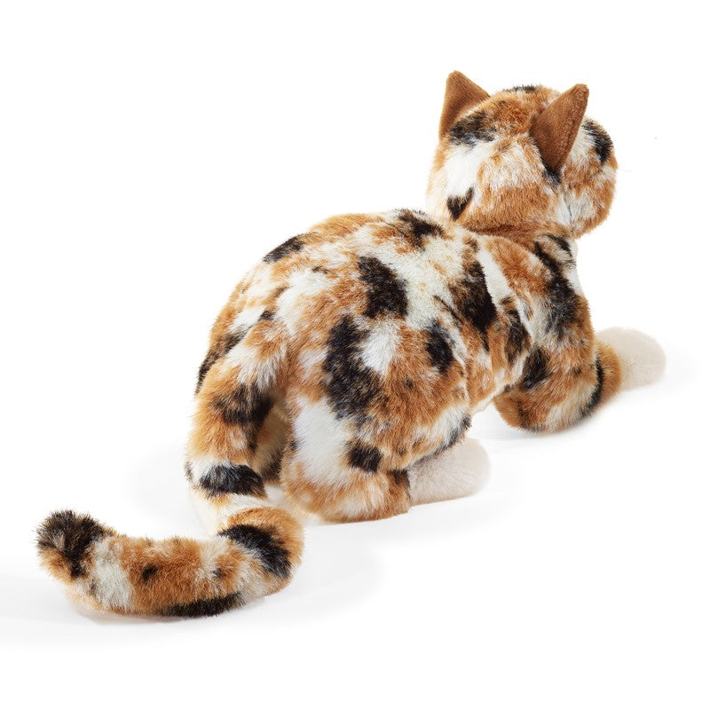 Plush toy cat with tortoiseshell pattern on a white background