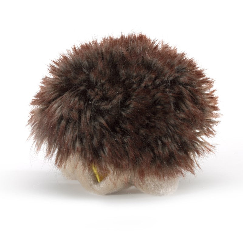 Brown fuzzy hedgehog toy on a white background