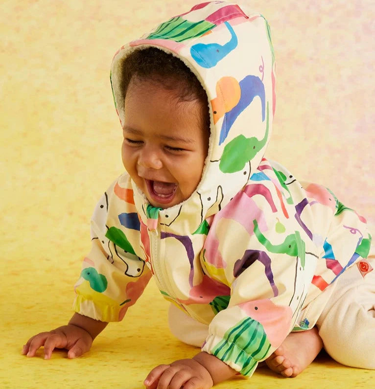 Raincoat with elephant print on background