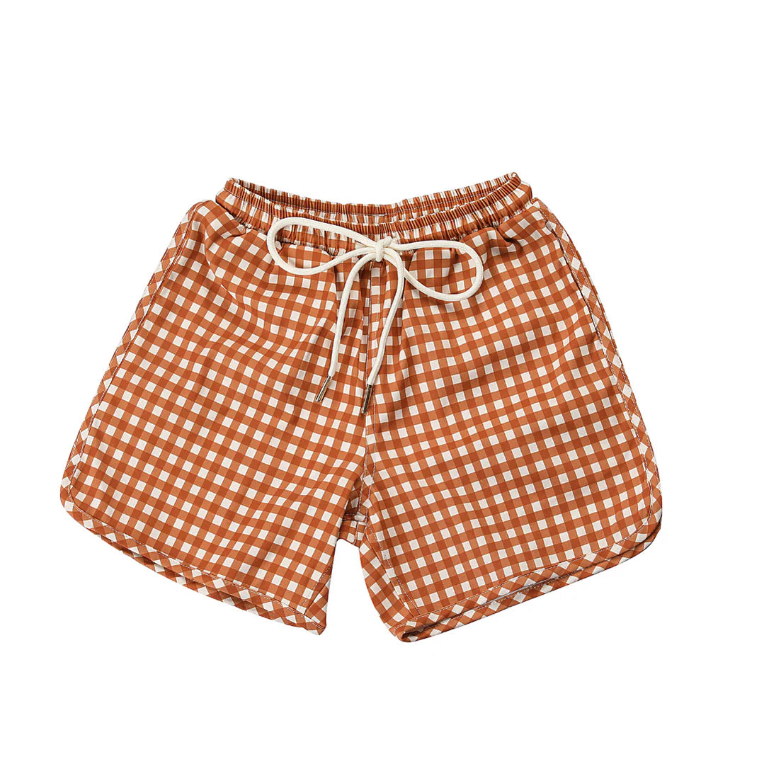 Orange and white checkered shorts with a drawstring on a white background