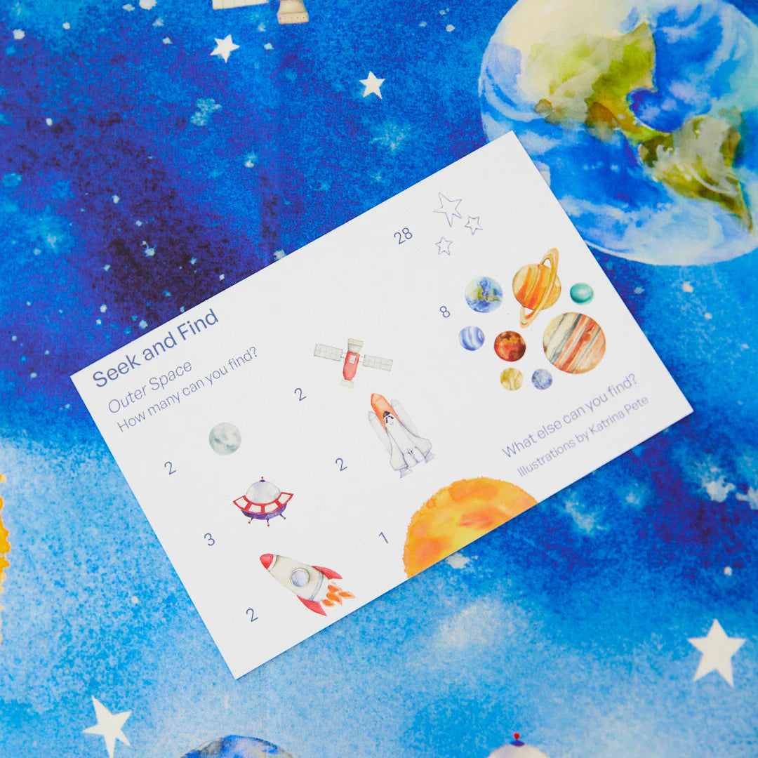 Children&#39;s activity silk titled &#39;Seek and Find Outer Space&#39; on a space-themed background with planets and stars.
