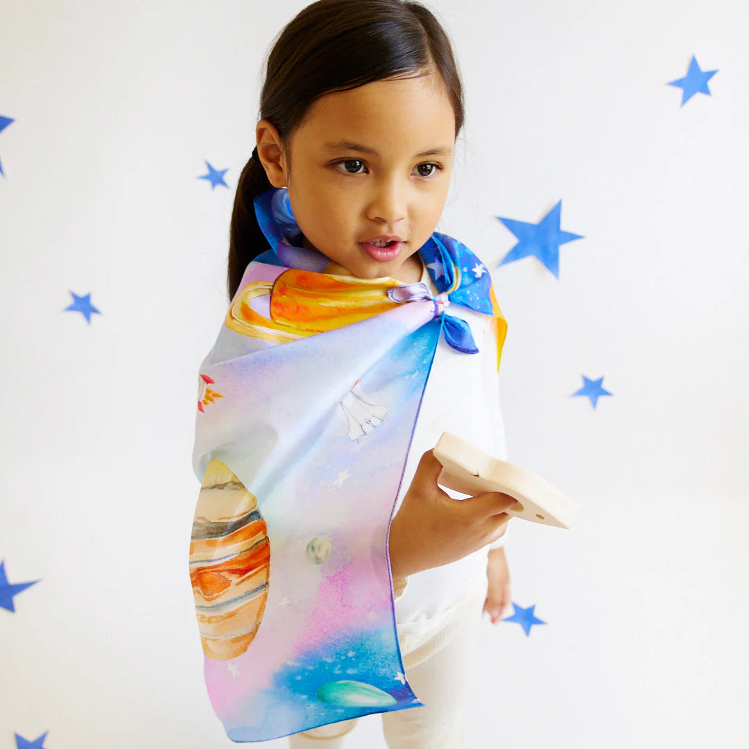 Play silk with space-themed design featuring planets, stars, and rockets on a blue background.