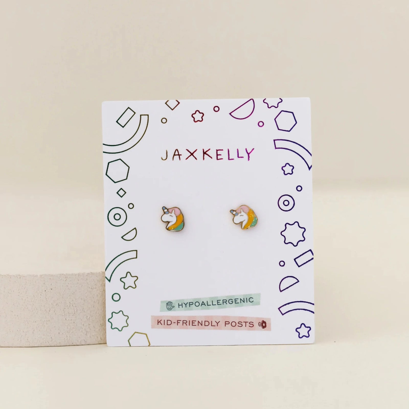 Unicorn-shaped earrings on a white background