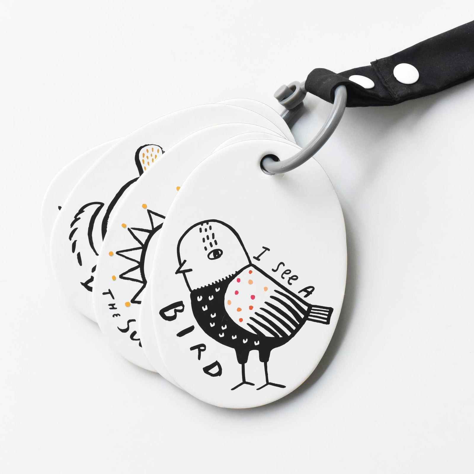 A set of illustrated stroller cards with a prompt card showing a drawing of a bird and the text 'I see a BIRD.'