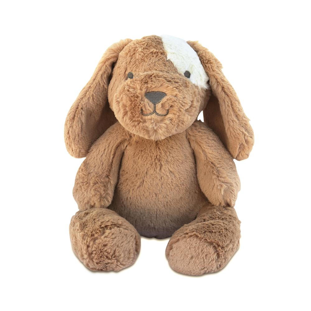 A soft plush toy resembling a dog with brown and white coloring and a visible stitched eye.