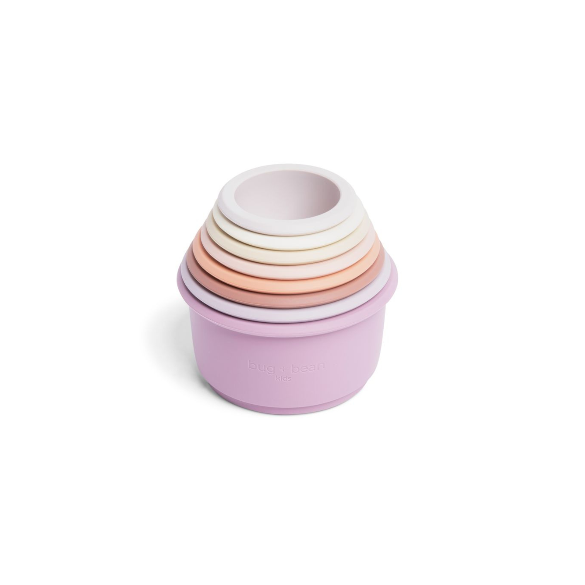 A set of stacking silicone cups in various pastel colors, with the topmost cup being white and the rest gradually getting lighter in color down to a purple base cup.