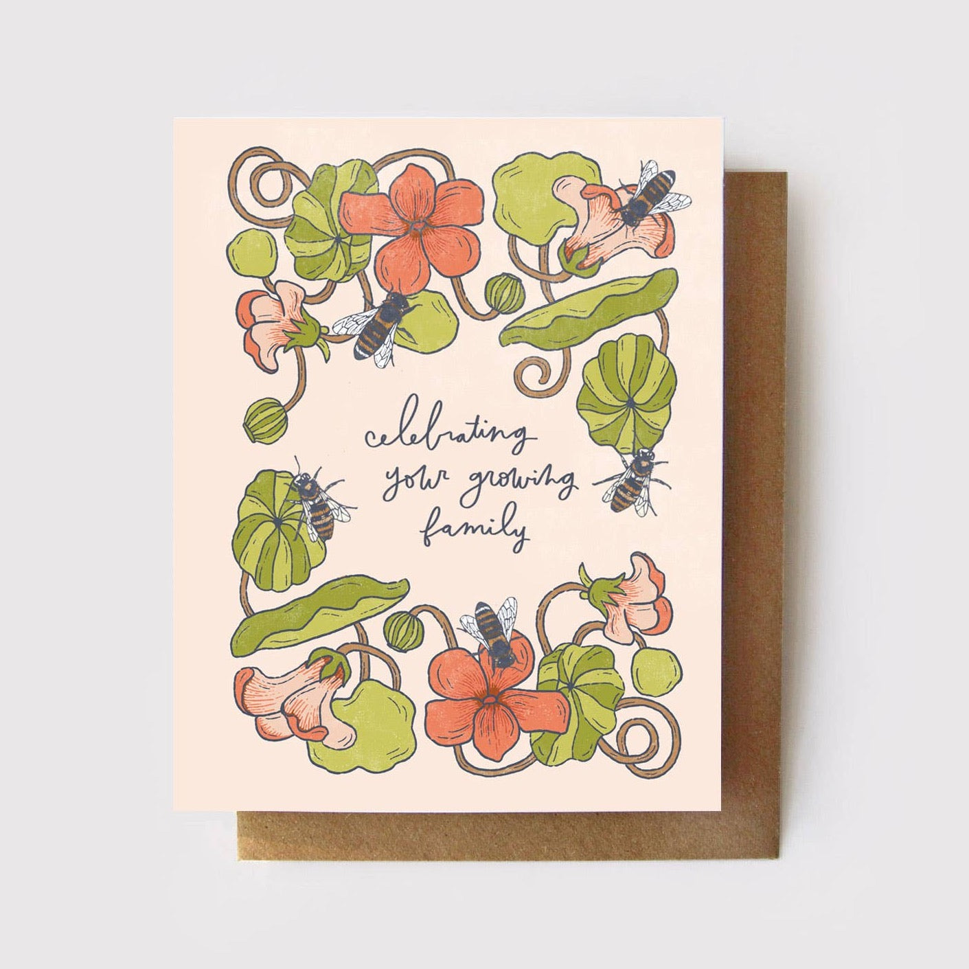 A greeting card with a floral design featuring nasturtiums and honeybees, and text that reads 'Celebrating Your Growing Family'.